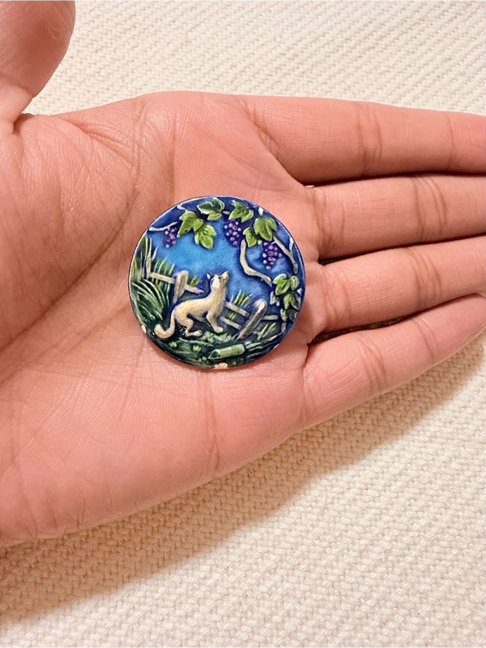 Vintage glazed ceramic "Fox and Grapes" fable brooch.